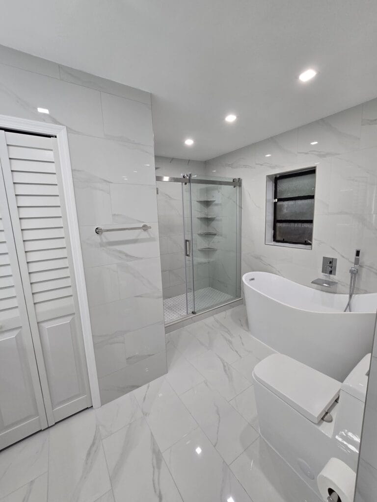 White Marble Guest Bath & Grey Stone Primary Suite Renovation — photo 2