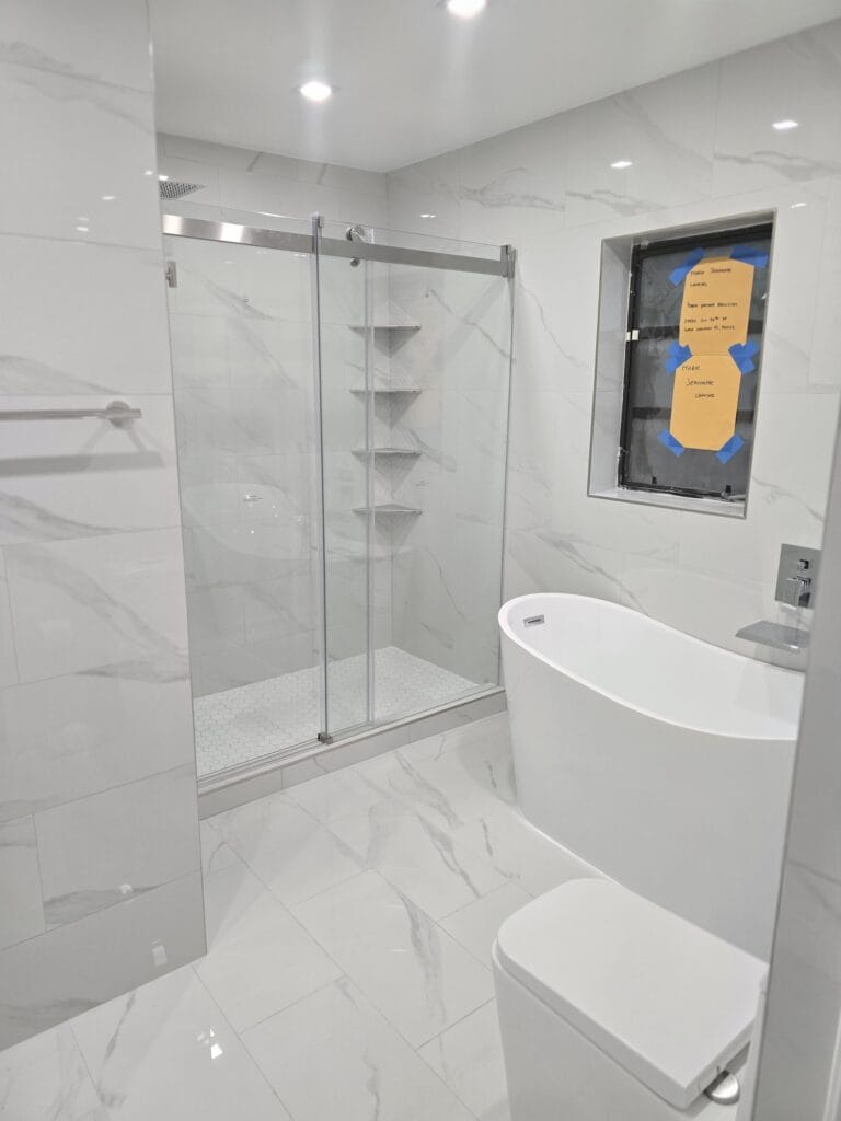 White Marble Guest Bath & Grey Stone Primary Suite Renovation — photo 3