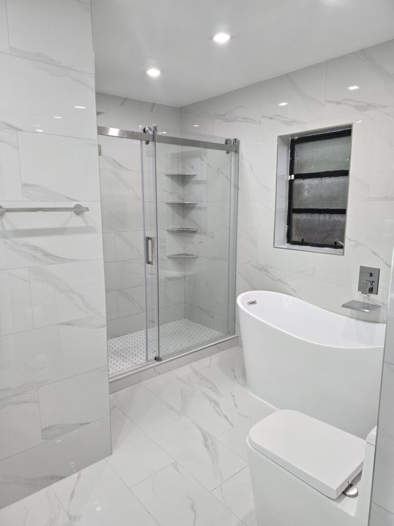 White Marble Guest Bath & Grey Stone Primary Suite Renovation — photo 4