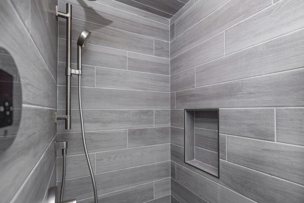 Whole-Home Bathroom Renovation with Spa Showers & a Freestanding Soaking Tub — photo 4