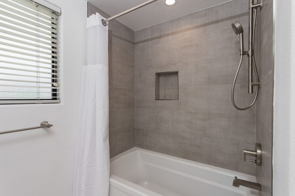 Whole-Home Bathroom Renovation with Spa Showers & a Freestanding Soaking Tub — photo 8