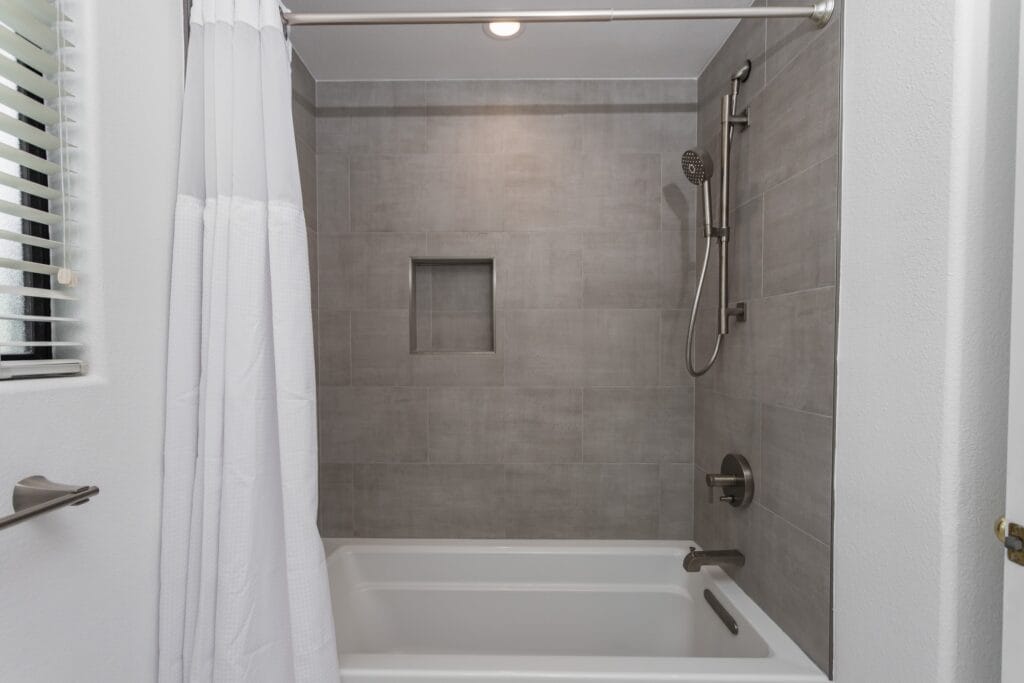 Whole-Home Bathroom Renovation with Spa Showers & a Freestanding Soaking Tub — photo 9