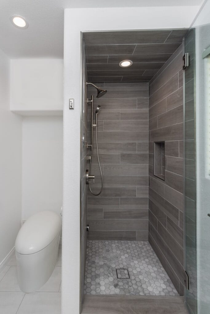 Whole-Home Bathroom Renovation with Spa Showers & a Freestanding Soaking Tub — photo 20
