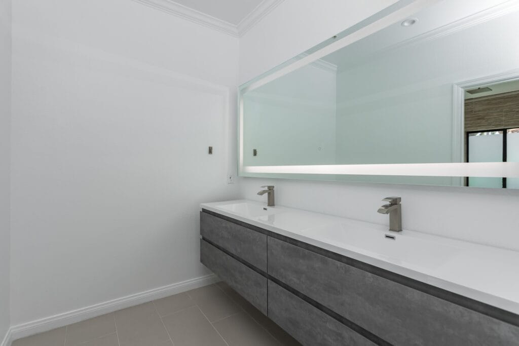 Whole-Home Bathroom Renovation with Spa Showers & a Freestanding Soaking Tub