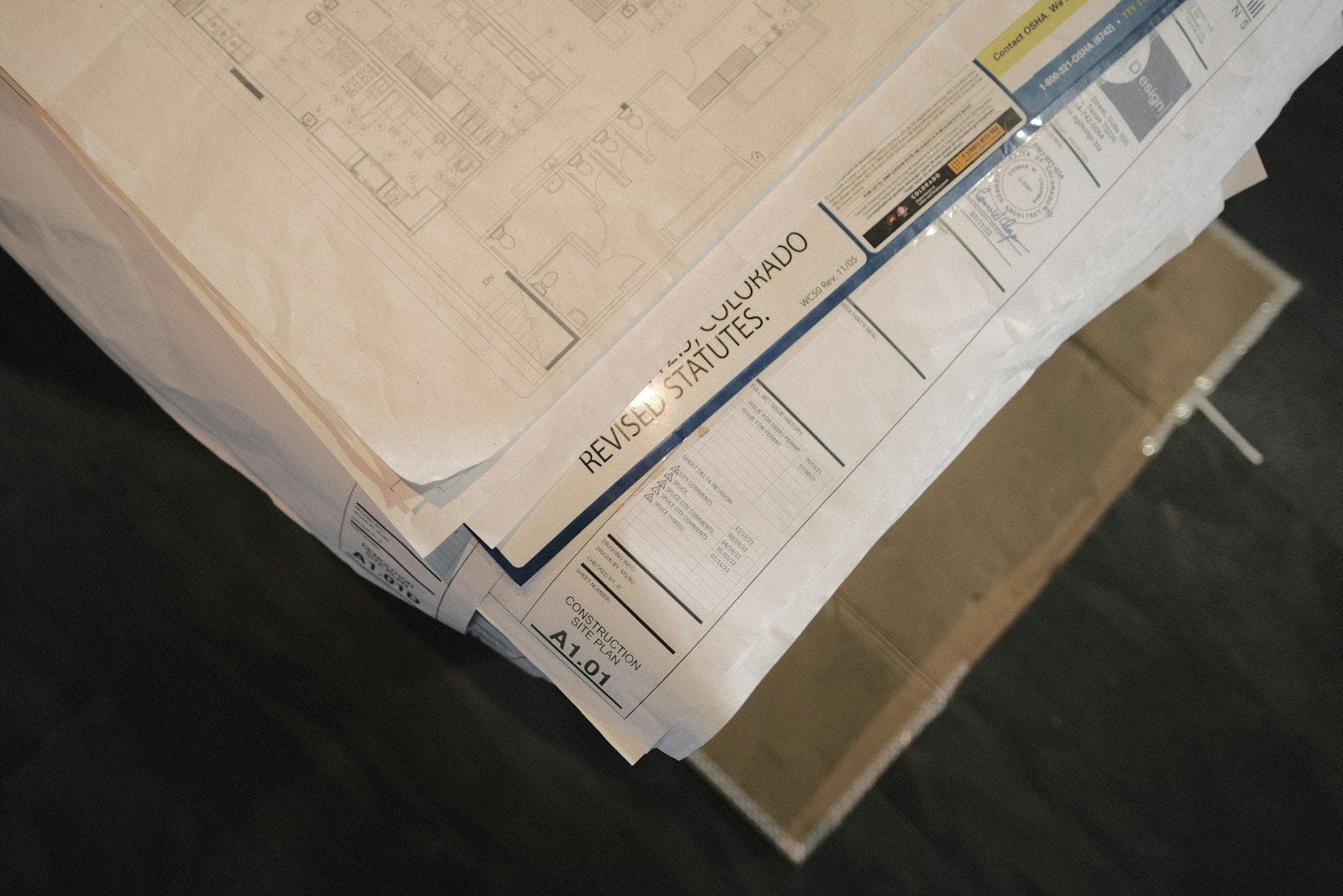 Construction site plan sheet showing a revision history and title block