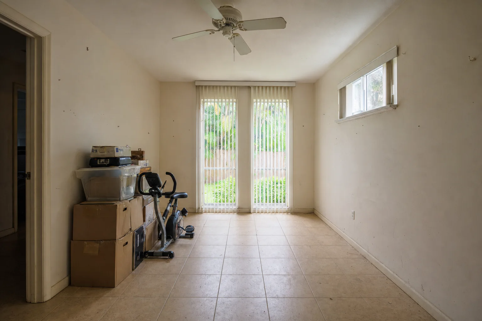 Illustration of a dated, underused end room used for storage before conversion into an in-law suite