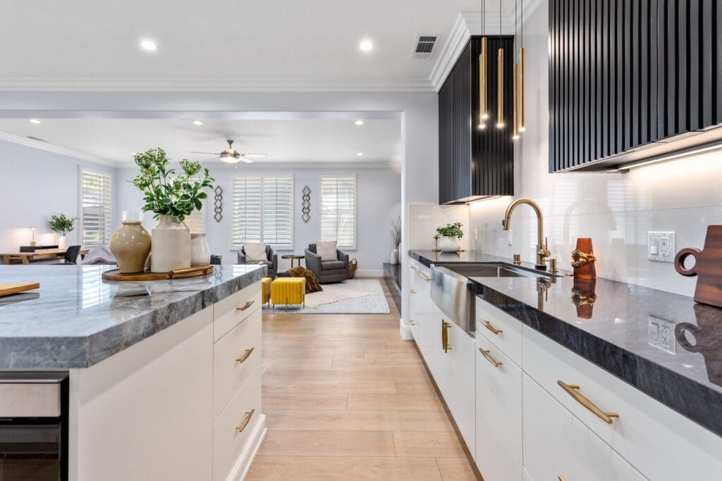 The same kitchen from the island, fluted black feature beyond.
