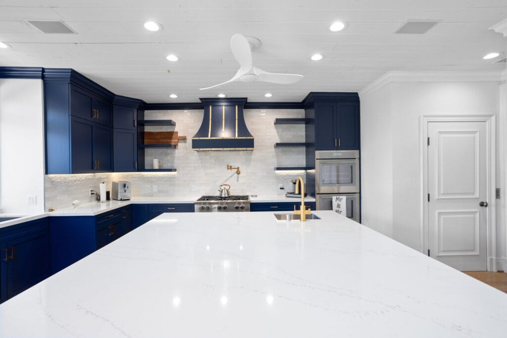Navy Blue Shaker Kitchen with Brass Hardware and a Custom Range Hood — photo 2