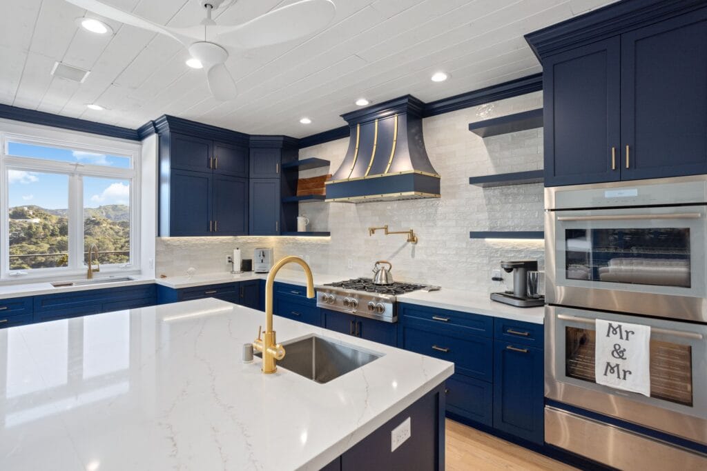 Navy Blue Shaker Kitchen with Brass Hardware and a Custom Range Hood — photo 3