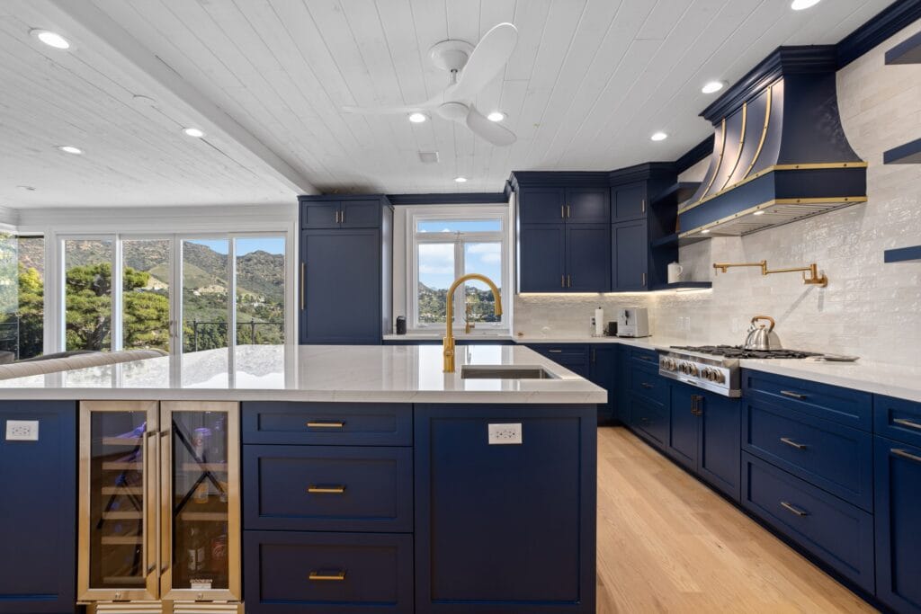 Navy Blue Shaker Kitchen with Brass Hardware and a Custom Range Hood — photo 4