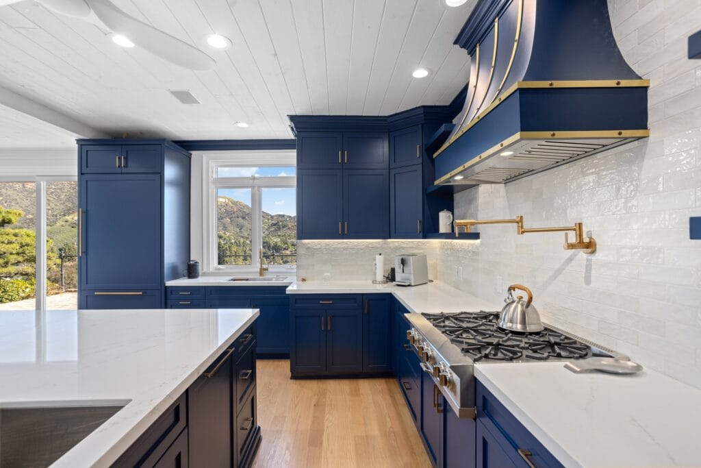Navy Blue Shaker Kitchen with Brass Hardware and a Custom Range Hood — photo 6