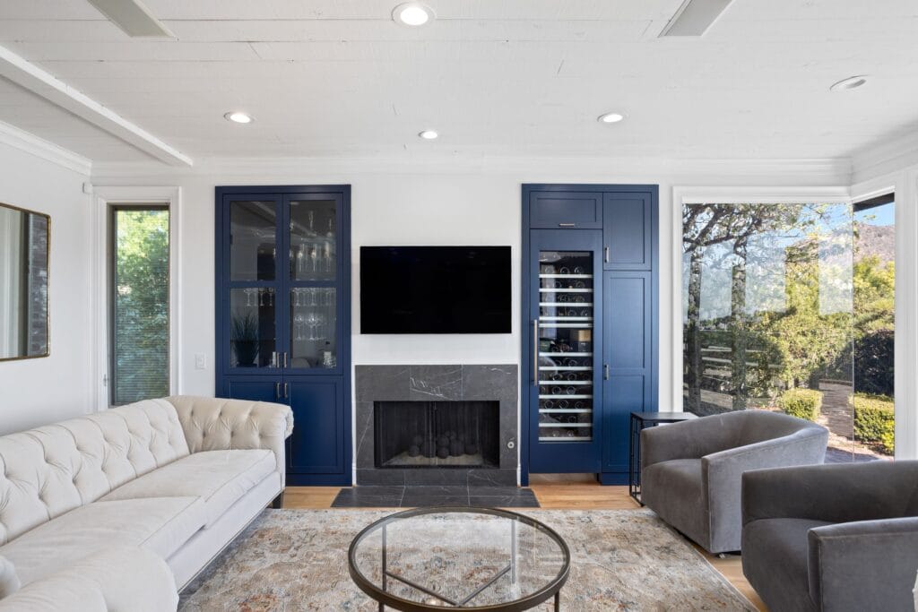 Navy Blue Shaker Kitchen with Brass Hardware and a Custom Range Hood — photo 12