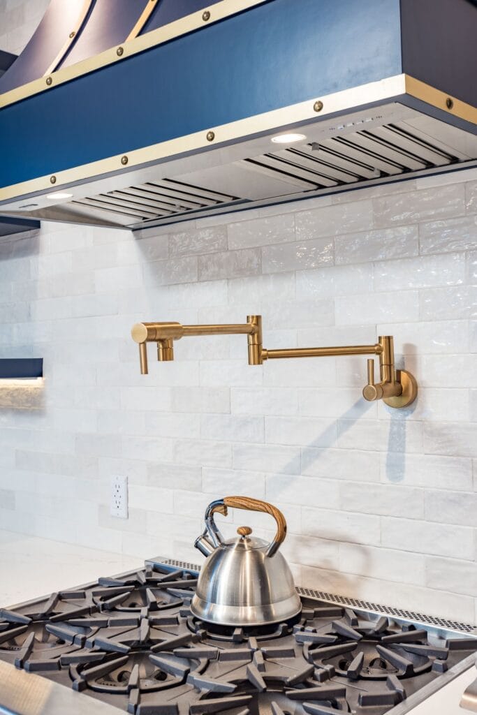 Navy Blue Shaker Kitchen with Brass Hardware and a Custom Range Hood — photo 23