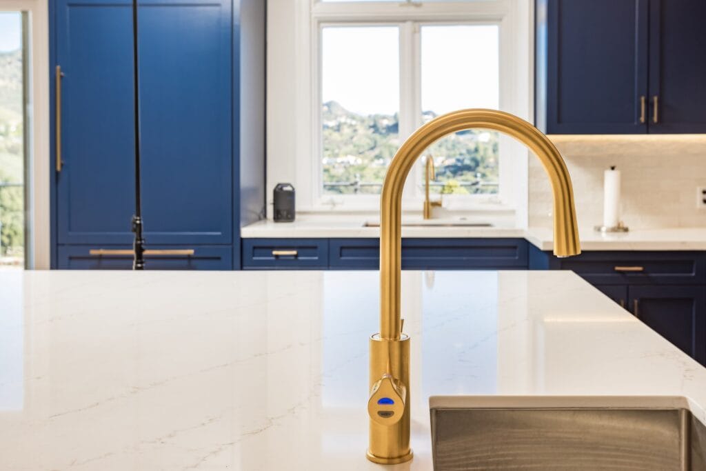 Navy Blue Shaker Kitchen with Brass Hardware and a Custom Range Hood — photo 25