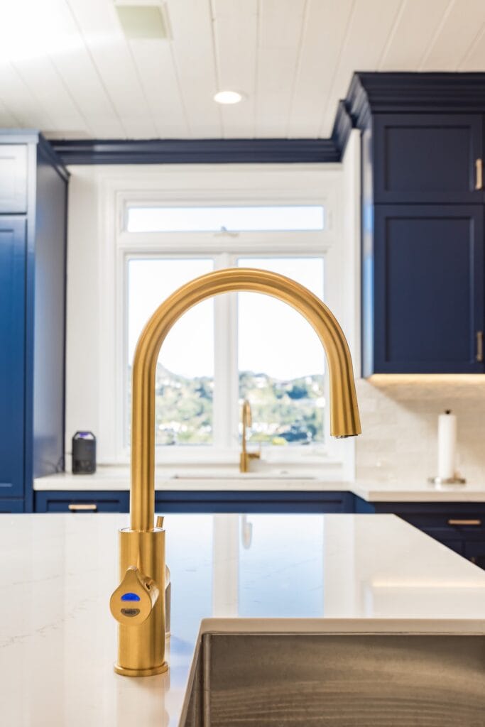 Navy Blue Shaker Kitchen with Brass Hardware and a Custom Range Hood — photo 26