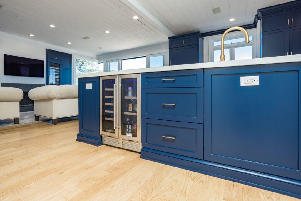 Navy Blue Shaker Kitchen with Brass Hardware and a Custom Range Hood — photo 28