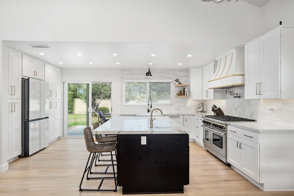 Two-Tone Kitchen Remodel with Custom Brass-Banded Range Hood — photo 4