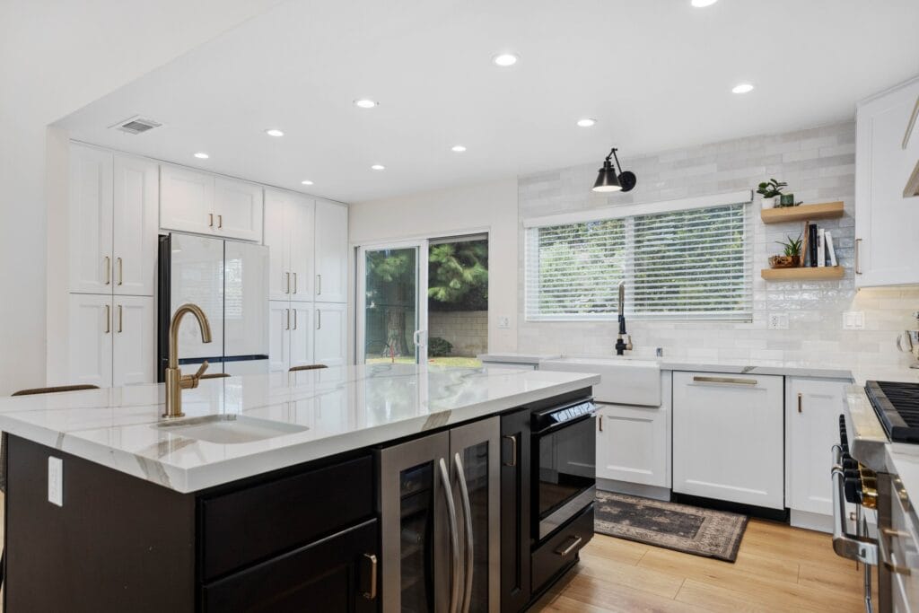 Two-Tone Kitchen Remodel with Custom Brass-Banded Range Hood — photo 5