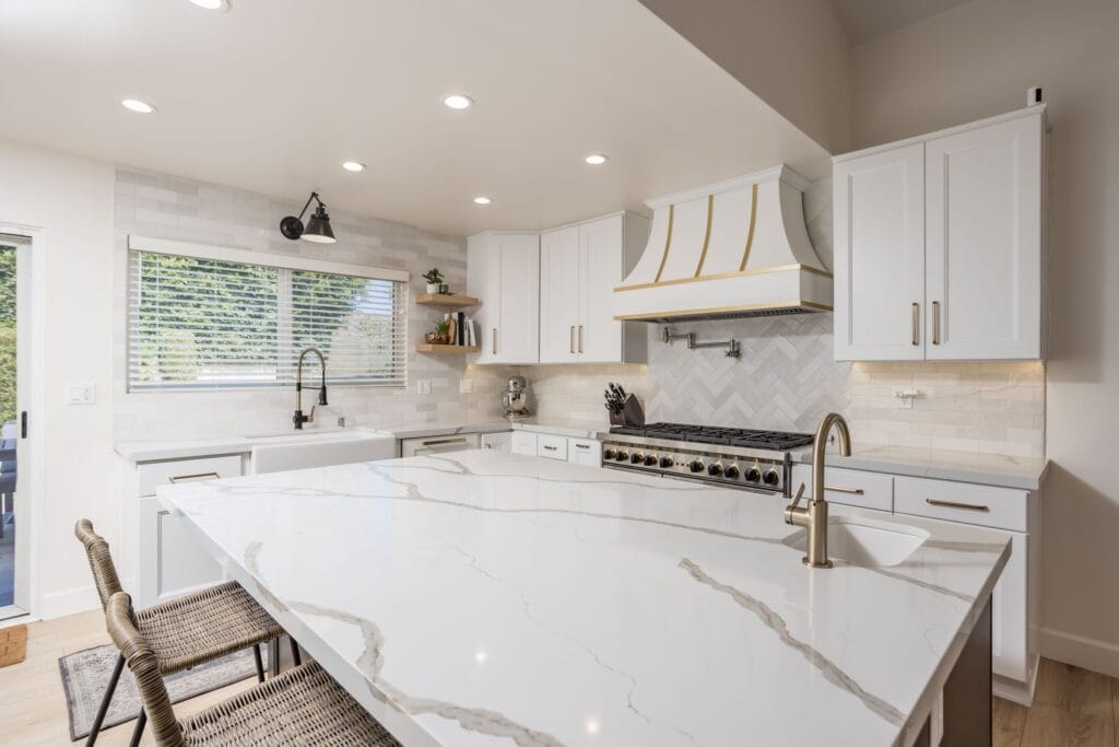 Two-Tone Kitchen Remodel with Custom Brass-Banded Range Hood — photo 10