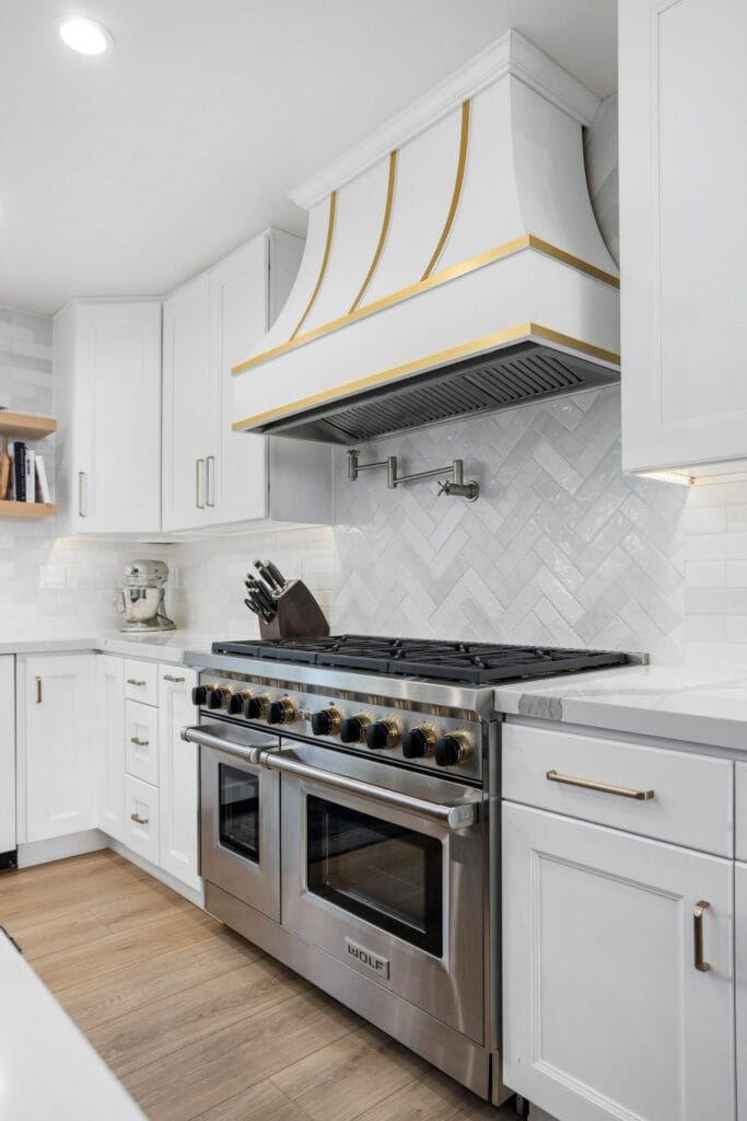 Two-Tone Kitchen Remodel with Custom Brass-Banded Range Hood — photo 13