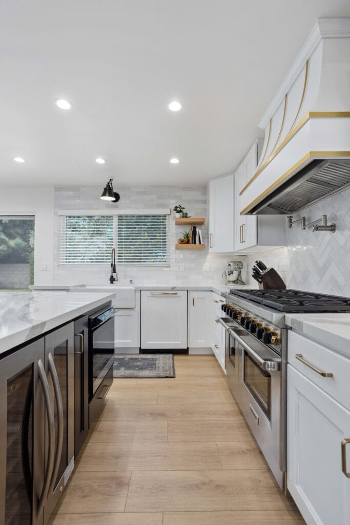 Two-Tone Kitchen Remodel with Custom Brass-Banded Range Hood — photo 14