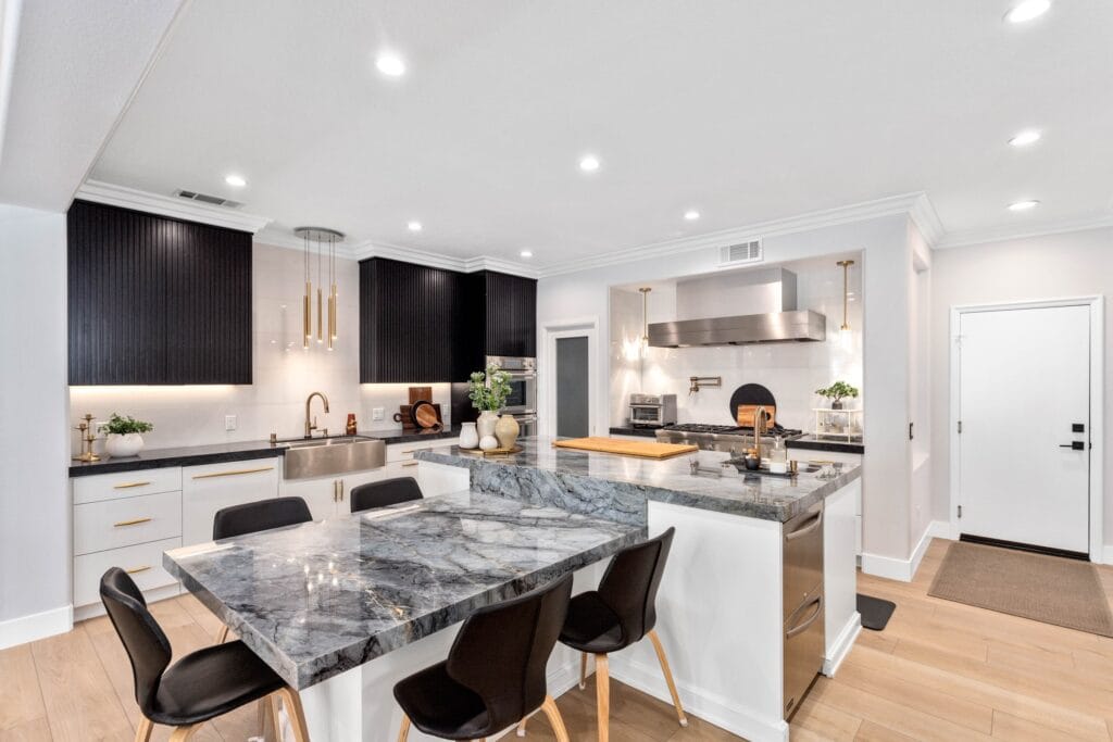 Two-Tone Kitchen Remodel with Waterfall Stone Island — photo 6
