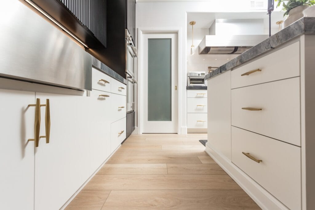Two-Tone Kitchen Remodel with Waterfall Stone Island — photo 21