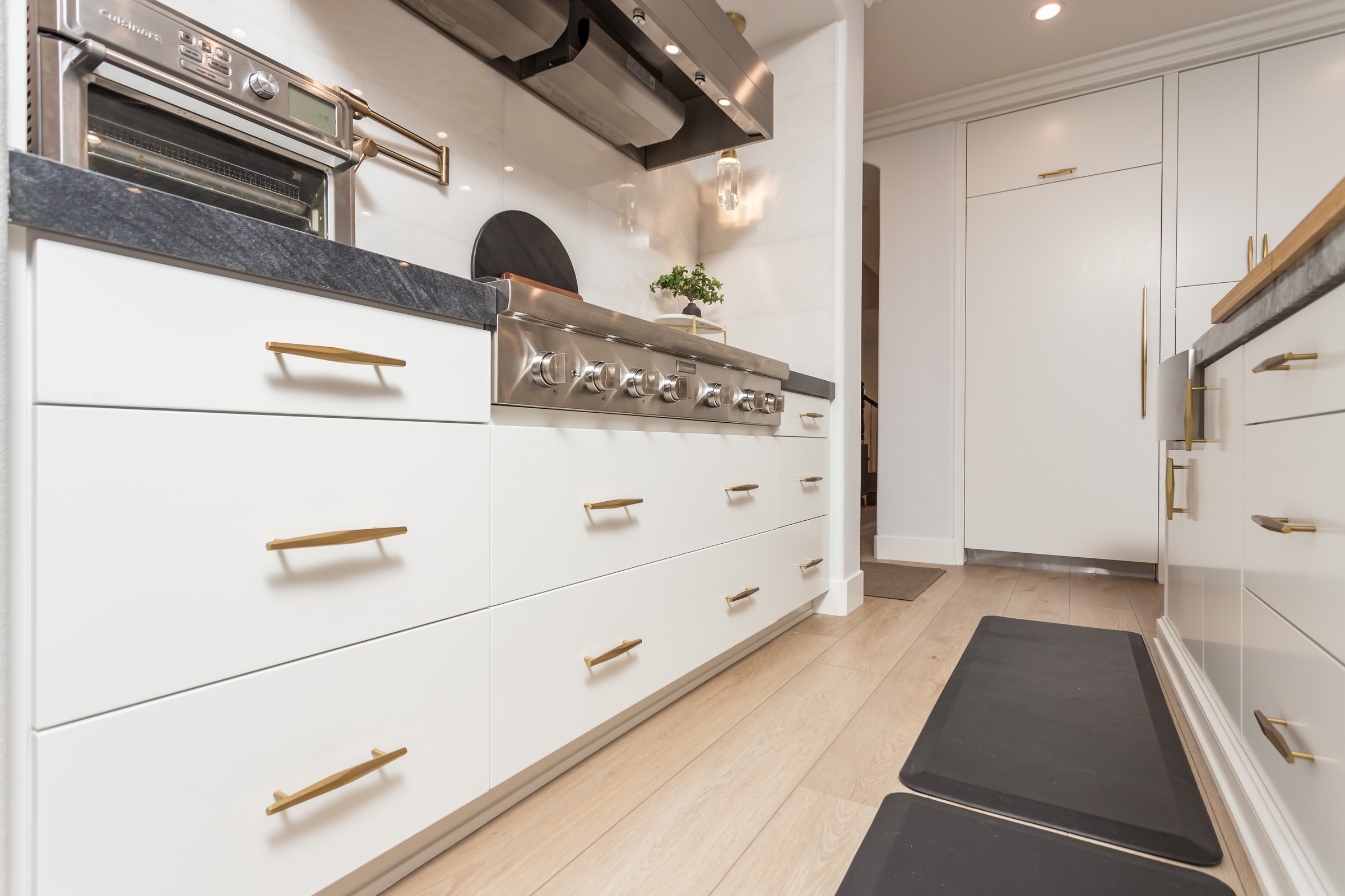 Two-Tone Kitchen Remodel with Waterfall Stone Island