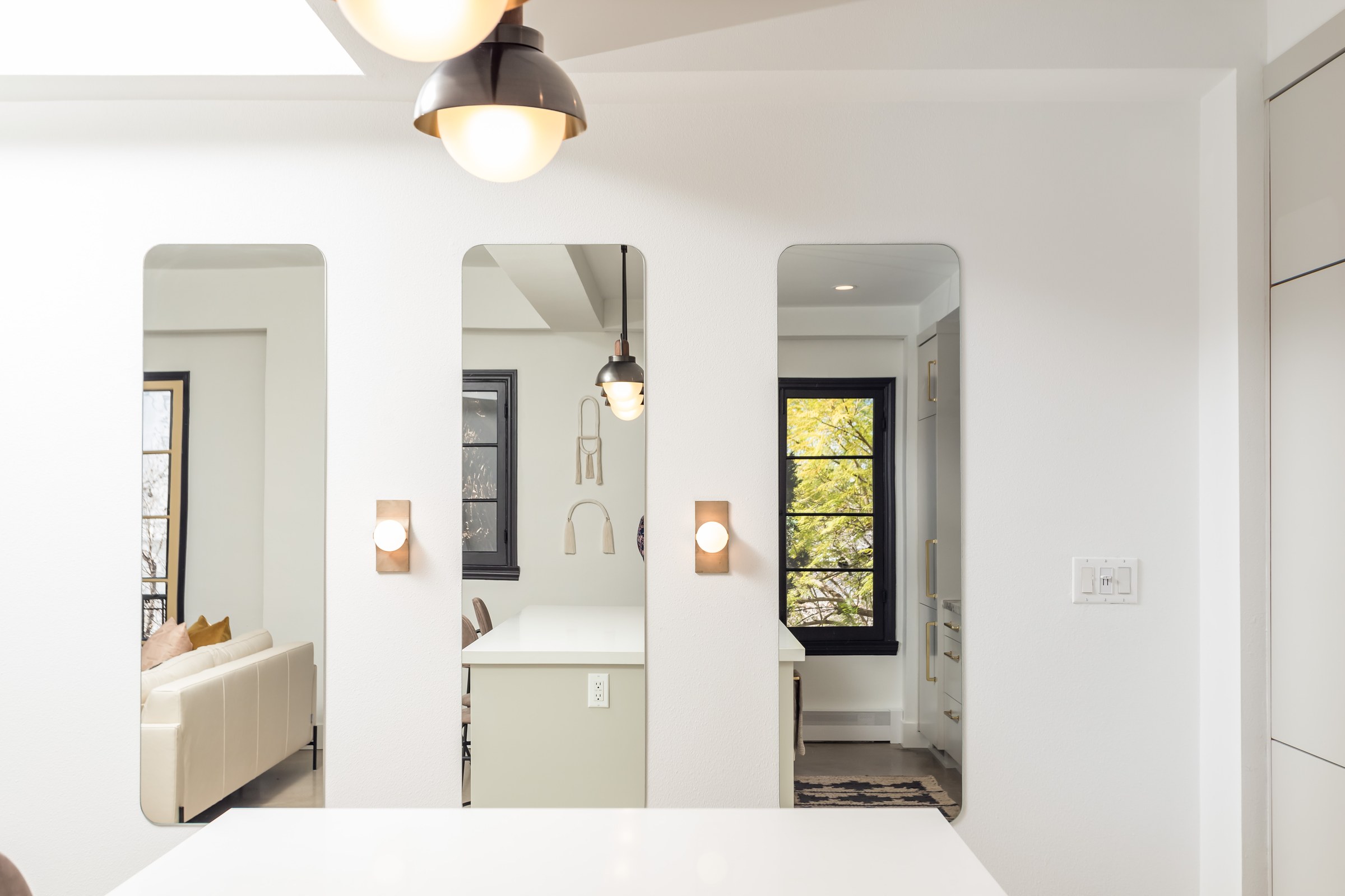 Open-Concept Kitchen Remodel with Fluted Walnut Cabinetry and Bookmatched Marble