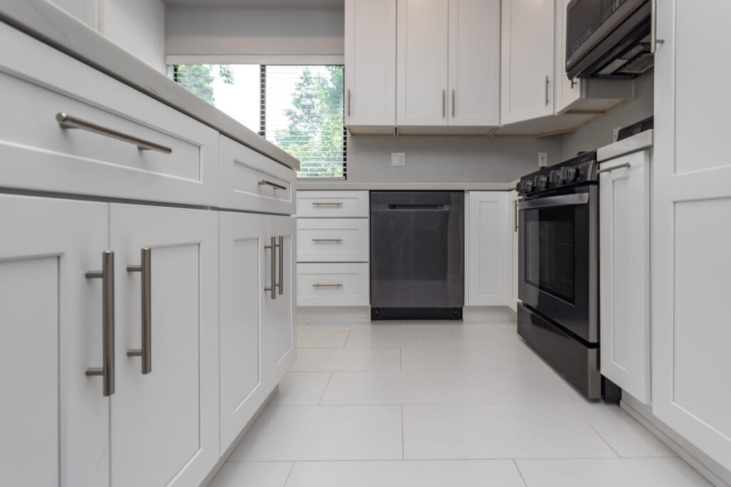 White Shaker Kitchen Remodel with Waterfall Quartz Island — photo 4