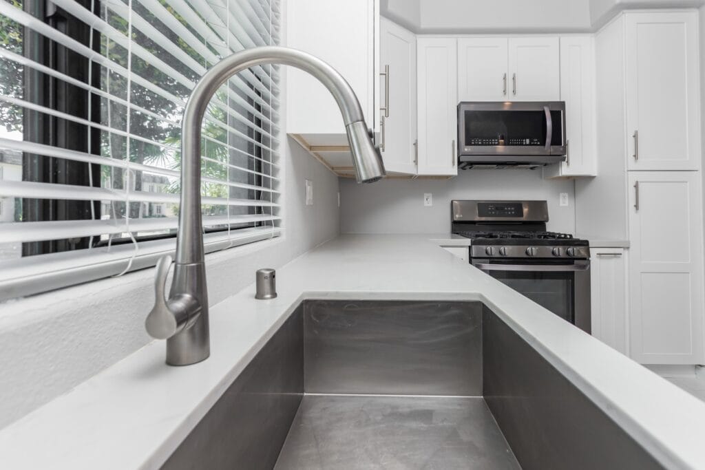 White Shaker Kitchen Remodel with Waterfall Quartz Island — photo 6