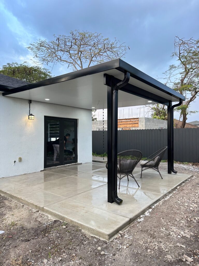 Completed cover over a finished rear patio with seating out