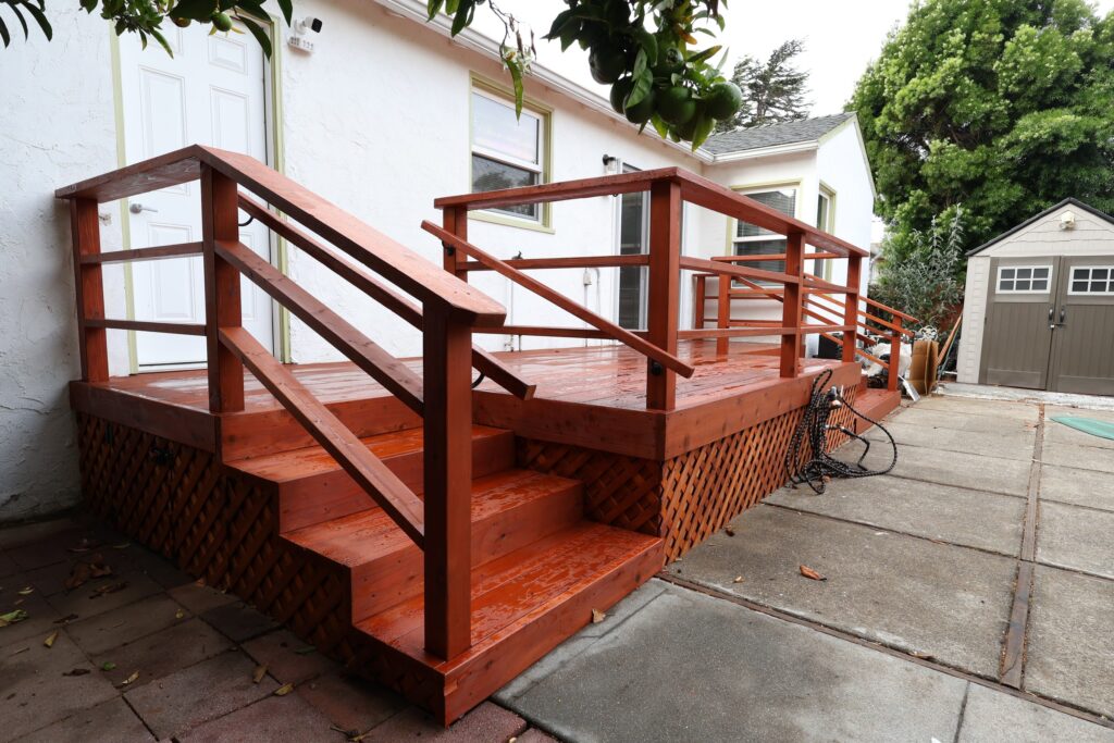 Custom Wood Deck with Staircase and Lattice Skirting — photo 2