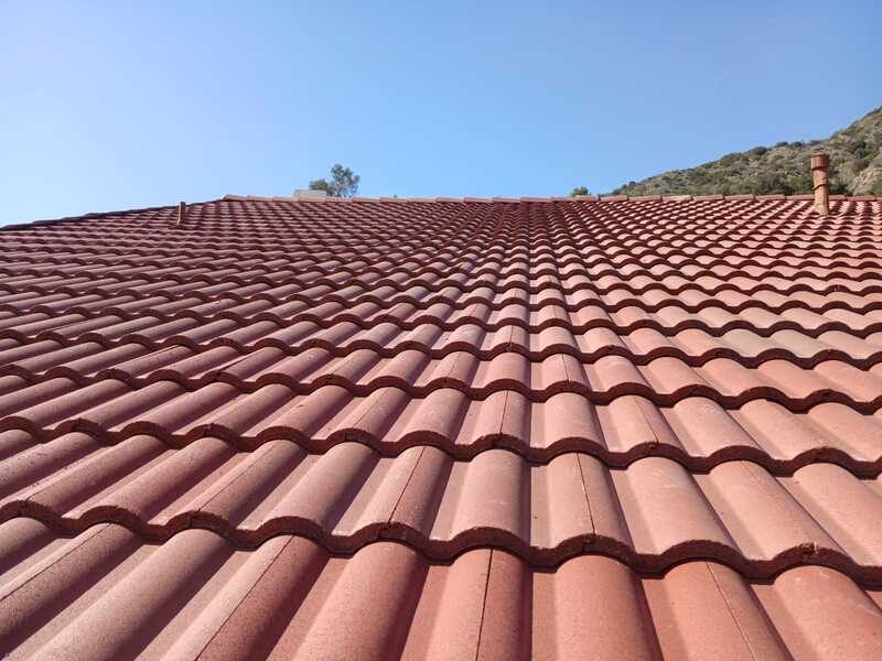 Completed barrel tile roof seen across the ridge