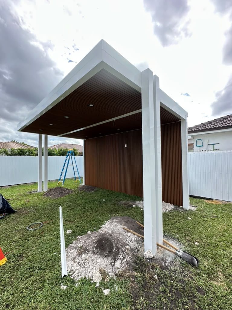Stucco at close range on South Florida houses photographed on Elbaz Construction project sites: rendered walls at openings, reveals, wall heads and new work meeting old