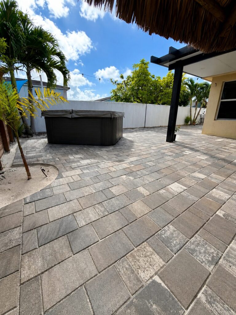 Stucco at close range on South Florida houses photographed on Elbaz Construction project sites: rendered walls at openings, reveals, wall heads and new work meeting old