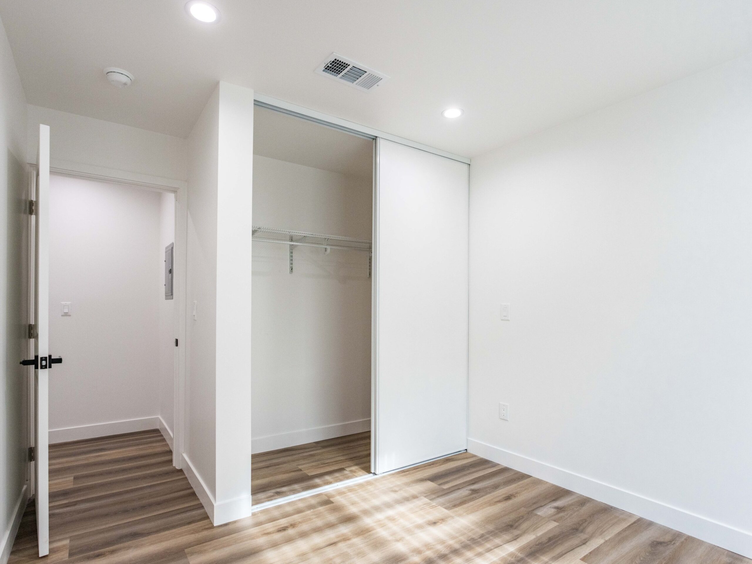 Built-in closet formed within the new partition layout of the conversion