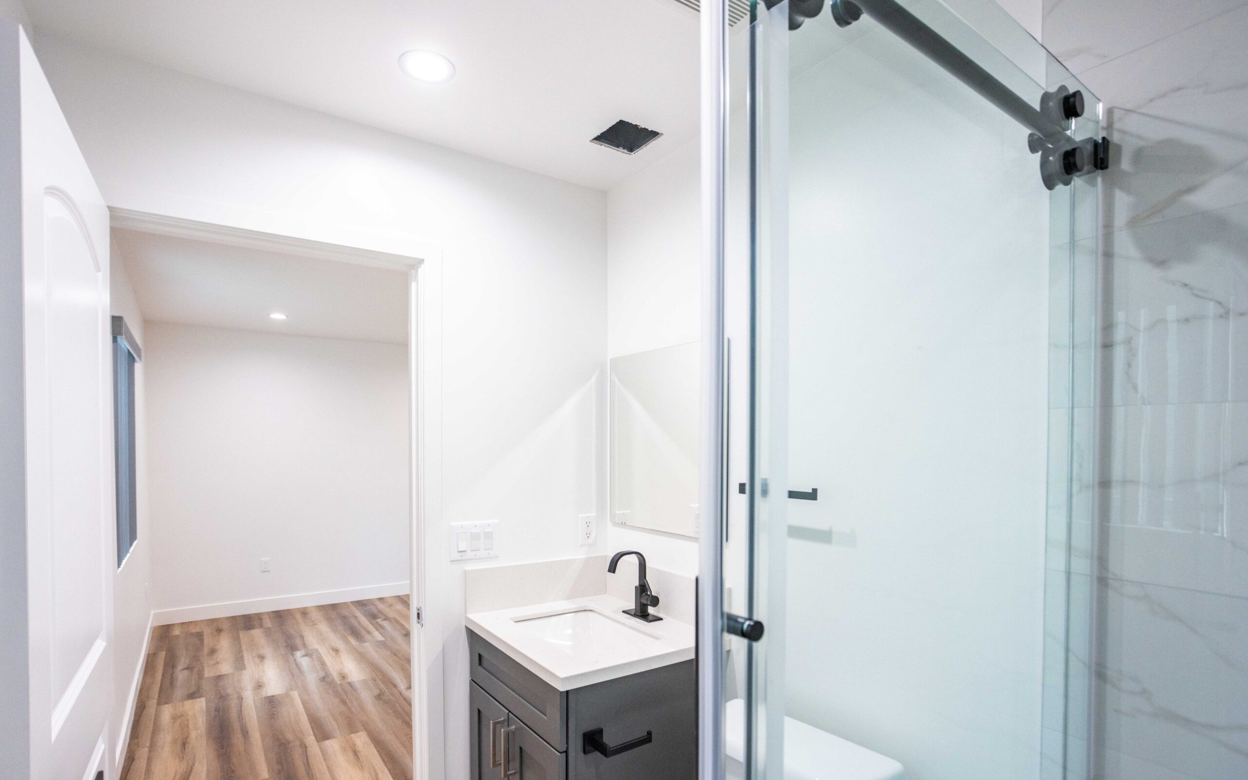 Hall connecting the living space, bedroom and bathroom of the converted unit