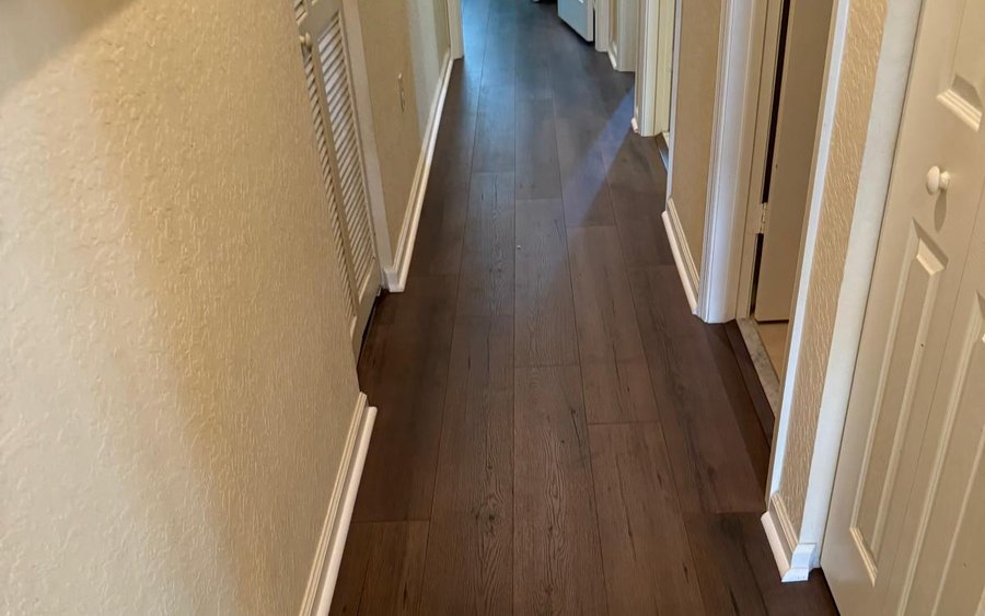 Transition where wood flooring meets an adjoining floor finish