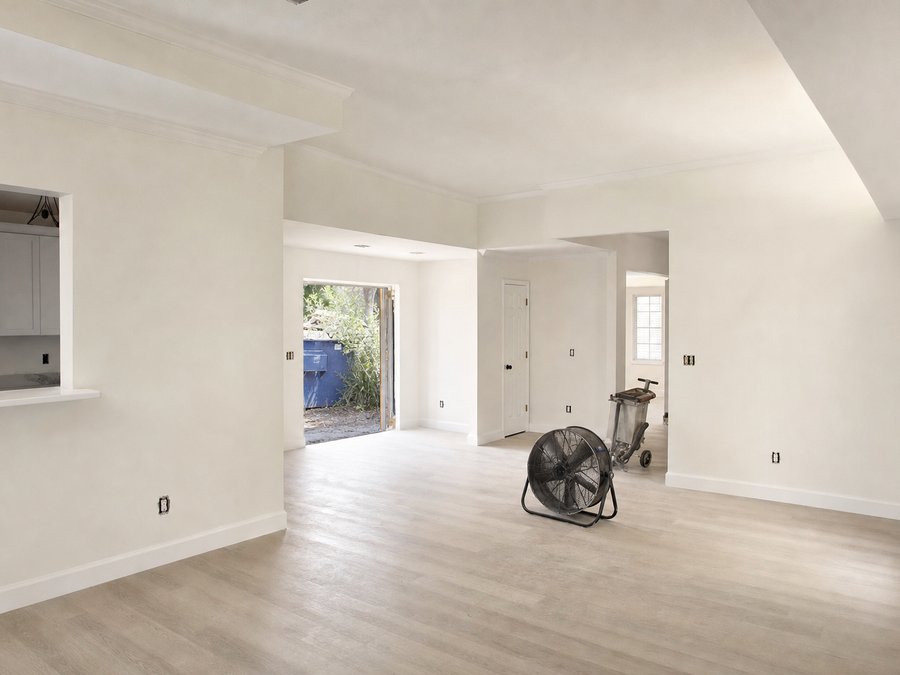 Illustration of a restored interior room, finished and repainted with new baseboard